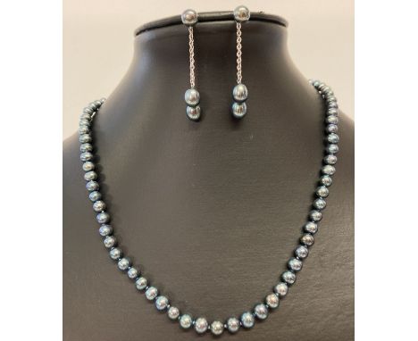 A peacock pearl necklace with silver clasp and matching 2-in-1 earrings.  Stud earrings with detachable drops. Both clasp to 