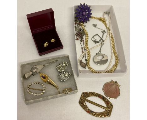 A collection of vintage and modern costume jewellery.  To include: seed pearl necklace, dress clips, buckles, Hollywood brooc