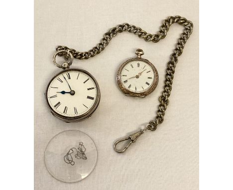 An antique silver pocket watch with engine turned decoration to back and empty cartouche.  Internal workings marked W.P.Price