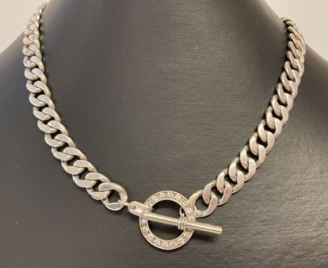 A heavy silver curb chain necklace with t bar and clear stone set fixing ring.  Fixings and ring marked 925, fixings have sca