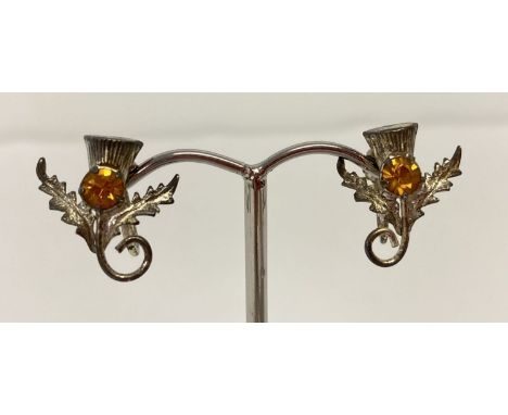 A pair of vintage Scottish thistle design screw back earrings set with small citrine' s.  Screw backs marked W.Bros, Silver. 