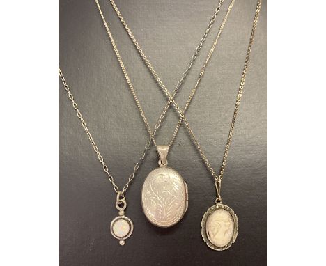 3 vintage and modern silver necklaces.  Comprising: an oval locket with floral engraving to front and back on a fine curb cha