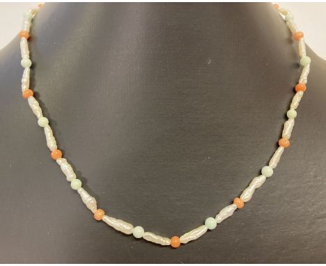 A baroque pearl, turquoise and coral bead necklace with 9ct gold clasp.  Total length approx. 22 inches long. 