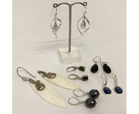 6 pairs of silver and white metal modern design drop style earrings  To include shell drops by Suarti (one post missing), pea