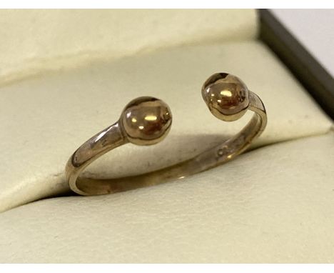 A 9ct gold open ball bar style ring.  Size M½.  Total weight approx. 1g.