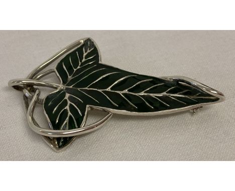 A silver Lorien Elven leaf shaped cape brooch/pendant from Lord Of The Rings.  Marks to back '925 STG NLP Inc'. 