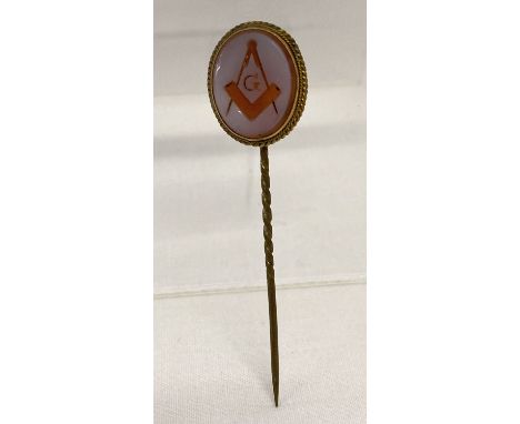 A Masonic Victorian Hardstone cameo style stick pin in gold mount.  Mount tests as 14ct gold. 