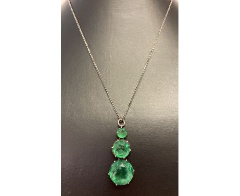 A vintage silver necklace with graduating round cut green fluorite drop pendant.  Fixing ring marked sterling. Clasp missing 