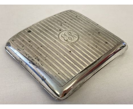 A silver cigarette case with engine turned decoration and engraved initials ER.  Hallmarked William Nerale &amp; Son 1942. Cl