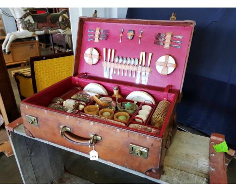 Leather Picnic TrunkLeather Picnic Trunk with the complete equipment. Silver cutlery. In very nice condition. 78 cm (30¾ in) 