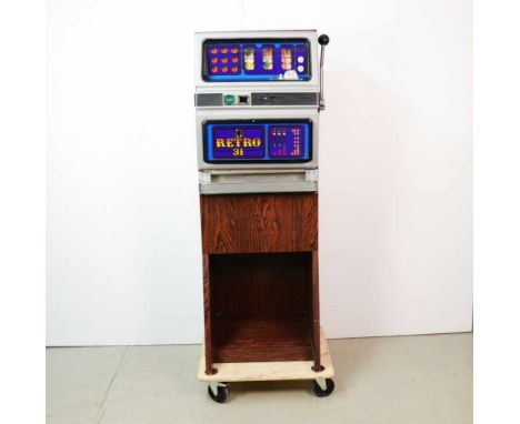 Swiss slot machine Retro 31Swiss slot machine Retro 31. Lights turn on, doesn't appear to be playable. Good visual condition,