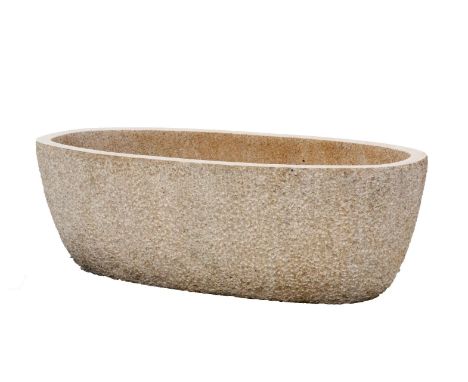 A substantial granite trough or planter, 20th century, of oval section, 66cm high, 202cm wide, 90cm deep   On view at: The Sc