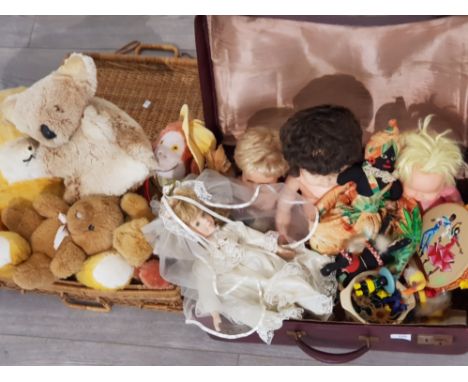 WICKER BASKET AND BRIEFCASE CONTAINING A SELECTION OF VINTAGE DOLLS, TEDDYS ETC
