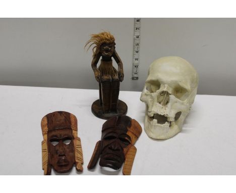 A selection of collectable items including ceramic skull 