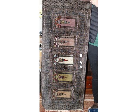 A hand knotted woolen Iranian runner/prayer mat 