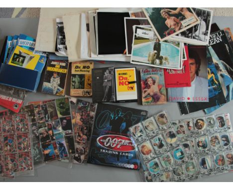 Mixed lot including James Bond 007 Trading card sets, Hammer Horror & Planet of the Apes. Paperback books for Dr No., Moonrak
