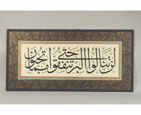 AN OTTOMAN CALLIGRAPHY PANEL, dated 1415, 98cm x 48cm.