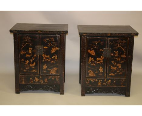 A PAIR OF CHINESE BLACK LACQUER AND CHINOSERIE DECORATED TWO-DOOR CABINETS, the pair of doors opening to reveal a shelf and s