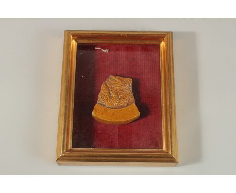AN 18TH-19TH CENTURY CHINESE GLAZED POTTERY TILE FRAGMENT, depicting a dragon, inset within glazed display case, fragment 8.5