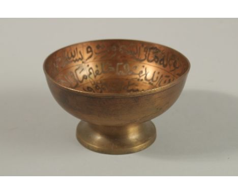 AN 18TH CENTURY INDIAN DECCANI FINELY ENGRAVED CALLIGRAPHIC BRASS MAGIC BOWL, with Quranic inscriptions, 13.5cm wide.