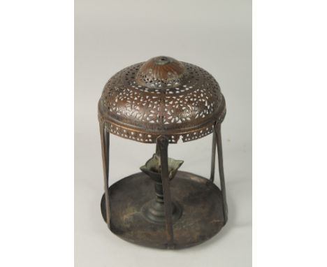 A FINE 18TH -19TH CENTURY MUGHAL INDIAN OIL LAMP, with openworked top, 36cm high.