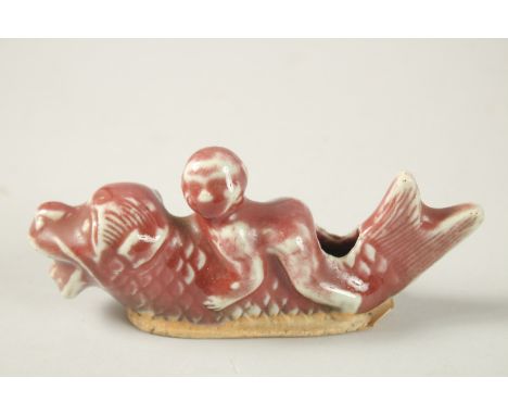 AN UNUSUAL KANGXI RED GLAZED FISH-FORM WATER DROPPER, 12.5cm long.