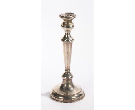 Silver candlestick, the waisted sconce above a tapering stem and loaded domed foot, stamped 925 to the foot, 24cm high