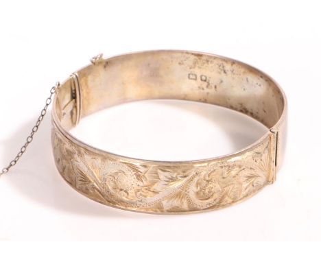 A sterling silver ornate bangle engraved 'Kathleen'.UK hallmarked.Diameter 2.5 inches. Weighing 47 grams.