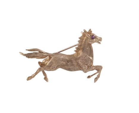 A GOLD HORSE BROOCH; together with a 9 carat gold bangle; and a signet ring mounted in 9 carat gold. (3)