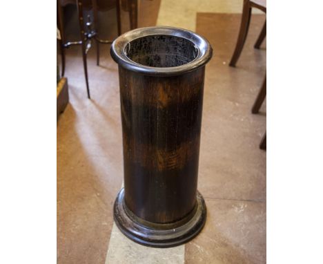 AN EDWARDIAN OAK AND BRASS BOUND CYLINDRICAL STICK STAND, fitted with original zinc liner. 66cm high