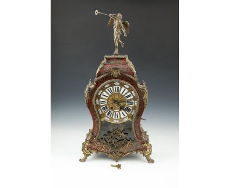 A LOUIS XV SCARLET BOULLE-WORK AND ORMOLU BRACKET CLOCK, the gilt dial set with individual enamel numerals, above a sunburst 