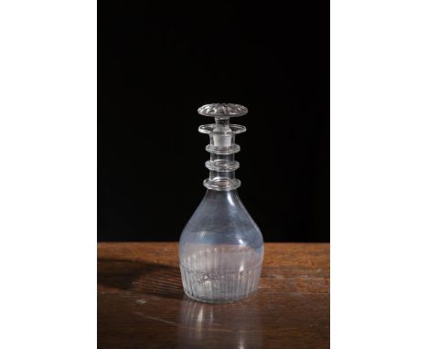 A 19TH CENTURY CORK GLASS COMPANY DECANTER AND STOPPER, of baluster form, with three serrated neck rings, and unrelated targe