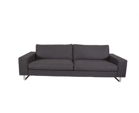 A 'BO CONCEPT' UPHOLSTERED SOFA, with loose back and seat cushions covered in charcoal felt fabric and raised on steel bracke