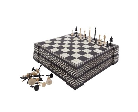 A LATE 18TH / EARLY 19TH CENTURY 'CAPTAIN COOK STYLE' IVORY CHESS SET, one side stained black, the other side left natural. T
