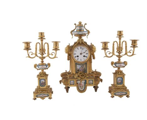 A FRENCH LOUIS SEIZE STYLE GILT BRASS CASED THREE PIECE CLOCK SET, with Sevres style panels and white enamel dial, 42cm high,