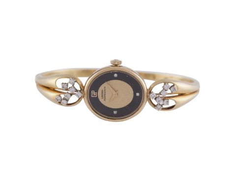 AN 18 CARAT GOLD AND DIAMOND BANGLE WATCH BY GERARD PERREGAUX