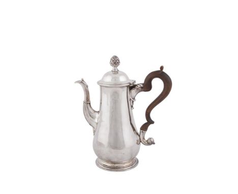AN IRISH GEORGE III PEAR SHAPED COFFEE POT, Dublin 1775, mark of William Ward, applied with acorn finial and walnut 's' scrol