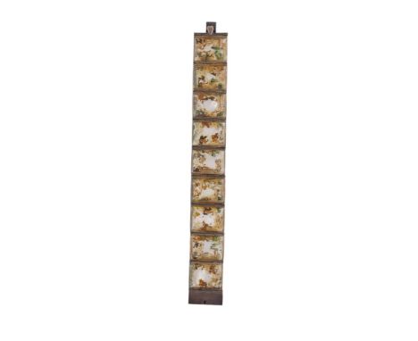 A CHINESE IVORY PLAQUE BRACELET, each hand painted ivory plaque depicting figures in pastoral scenes within a silver setting.