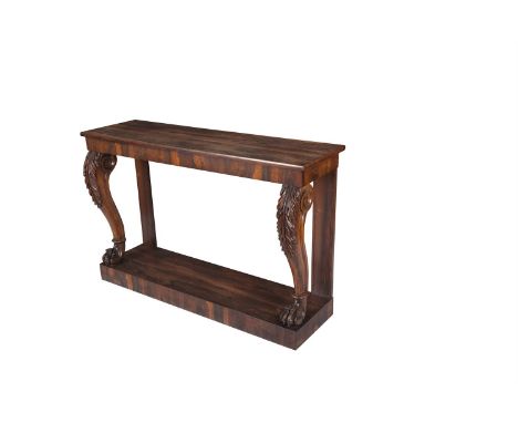 A WILLIAM IV ROSEWOOD CONSOLE TABLE, c.1830, of rectangular form, the moulded top on acanthus carved cabriole supports and pl