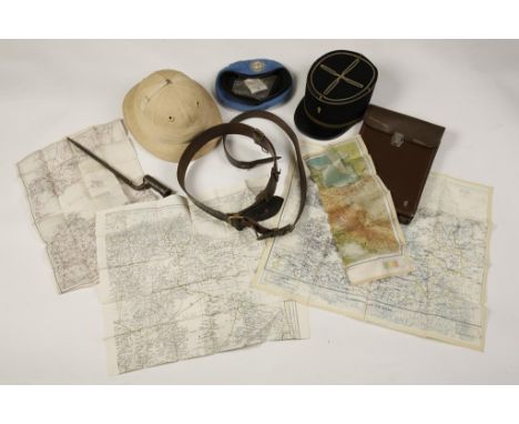 A U.N. BERET, French Kepi, Pith hat, silk war maps, Sam Browne belt, bayonet and a leather field map case.