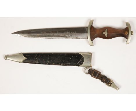 A GERMAN NAZI SA DRESS DAGGER with engraved blade, scabbard and original leather suspension