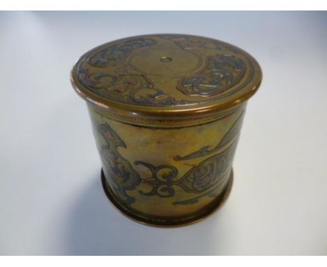 A FIRST WORLD WAR SHELL, converted into a tobacco box with Eastern silvered and copper decoration.