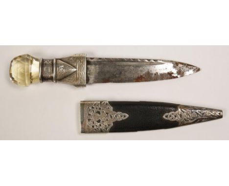 A SCOTTISH SKEAN DHU with white metal mounts, engraved with Celtic style decoration, 19th century.