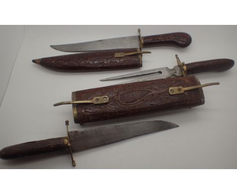 Indian wooden cased carving knife and fork set and a wooden cased carving knife 