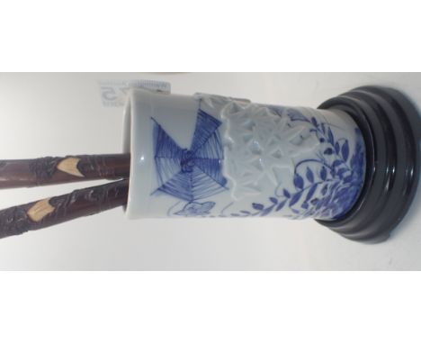 Oriental ceramic blue and white brush pot with a pair of Oriental wood carved rests
