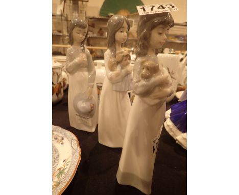 Three Nao young girl figurines