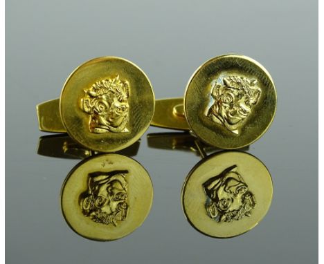 A pair of 14ct gold smiling bull cufflinks, 16.1mm across, 9.7g.