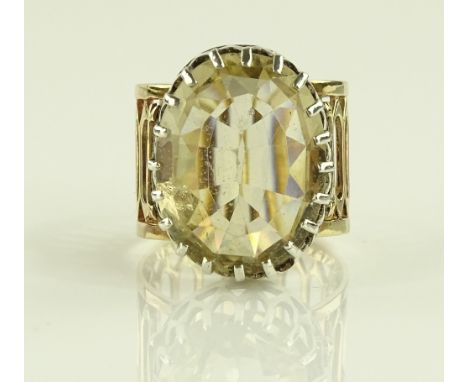 A Victorian large oval cut citrine dress ring, unmarked pierced gold and silver settings, setting height 18.8mm, size M.