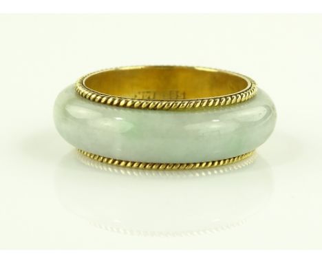 A 14ct gold jade band ring, size P.