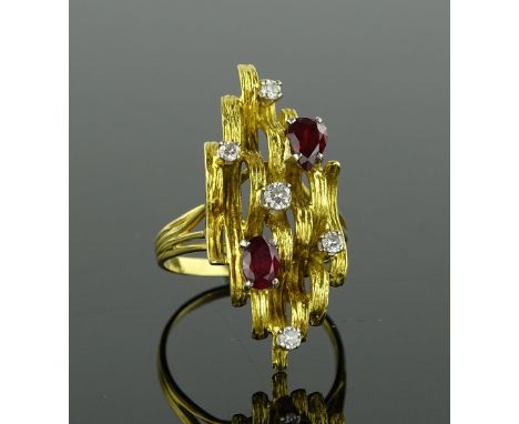 A large 18ct gold ruby and diamond abstract dress ring, circa 1970s, setting height 36mm, size V.